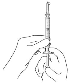 No air bubbles and a drop of drug at the needle tip.image