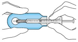 Syringe with initial fill needle inserted through the implant septum.image