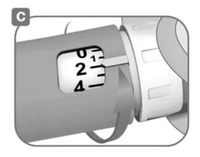 select a dose of 2 units by turning the white dose knob.image