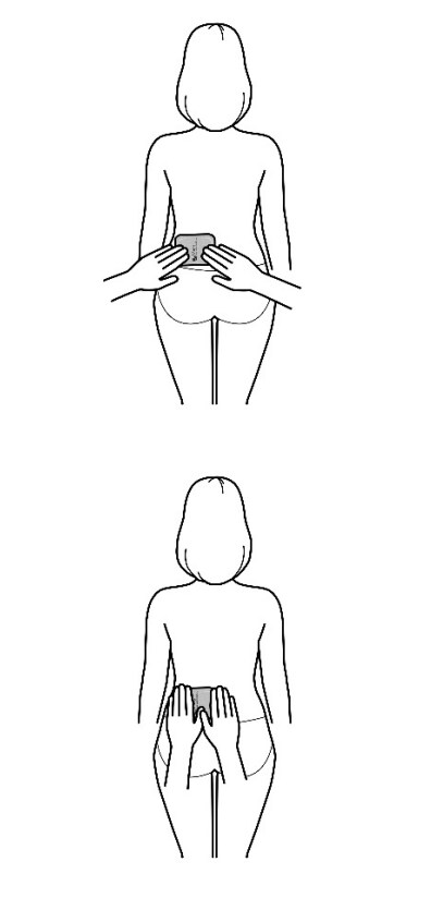 Image showing smoothing down the edges of the Adlarity transdermal system when applied horizontally.