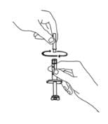 Continue to hold the barrel of the syringe. With your free-hand, twist the 27-gauge needle onto the tip of the syringe until it fits snugly. Do not remove the needle cover from the syringe image.