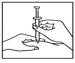 While still pinching the skin, quickly insert the needle like a dart at about a 90 degree angle (just under the skin) into the pad of tissue as shown.