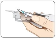 Push finger up through the hole in the bottom of tray. 