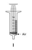 While keeping the oral syringe in the mouth, slowly push down on the plunger until a small amount of air is left in the oral syringe, between the plunger and the tip of the oral syringe.