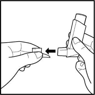 Removing cap from Ventolin HFA inhaler.