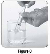 Use the 10 mL oral syringe to draw up 10 mL of water. 
