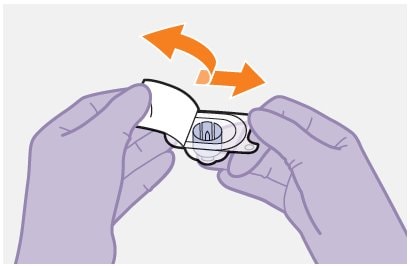 Peel off the paper backing from the Apretude vial adapter packaging.