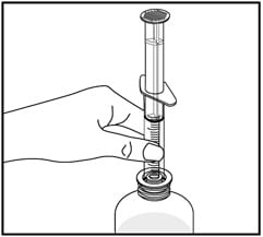 Insert the tip of the oral dispenser into the bottle adapter on your Vfend oral suspension.