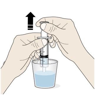  Insert the tip of the oral syringe into the oral solution and slowly pull up on the plunger until the plunger stopper lines up with the syringe marking for the prescribed dose.