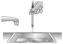 Over a sink, push the water out of the Livmarli dosing dispenser, repeating several times.