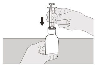 Place the Evrysdi bottle on a flat surface. While keeping the bottle in an upright position, insert the syringe tip into the bottle adapter.image