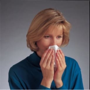 While sitting down, gently blow your nose to clear your nasal passages. image