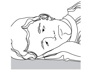 Lie down on your side so affected ear faces upwards image.