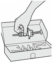 Remove the Dupixent syringe from the carton by holding the middle of the syringe body.