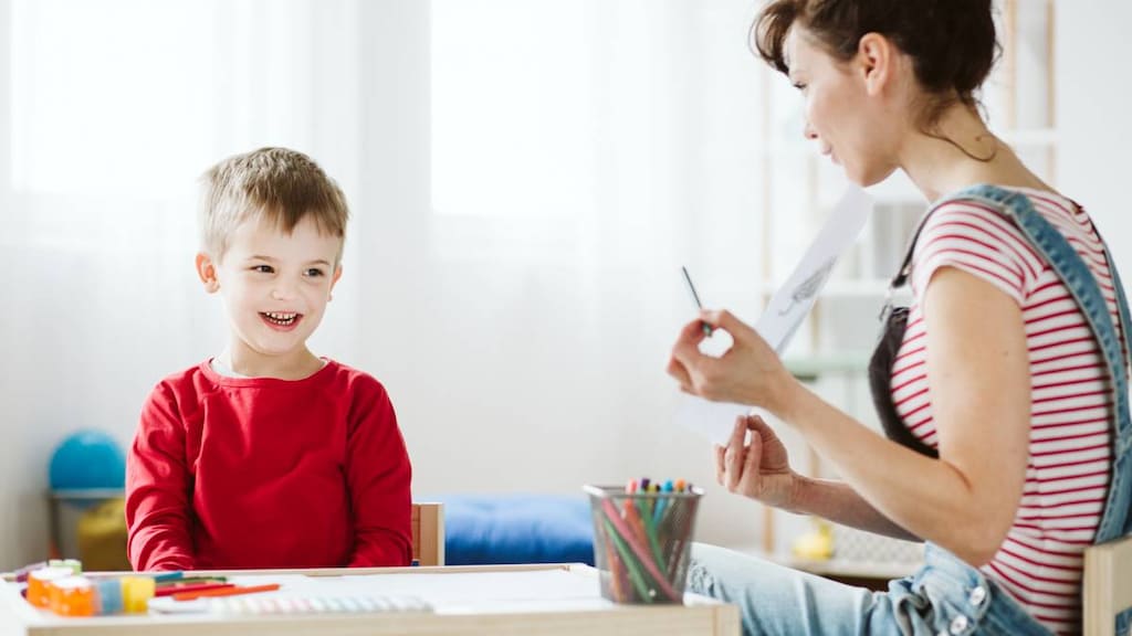 Woman teaching child