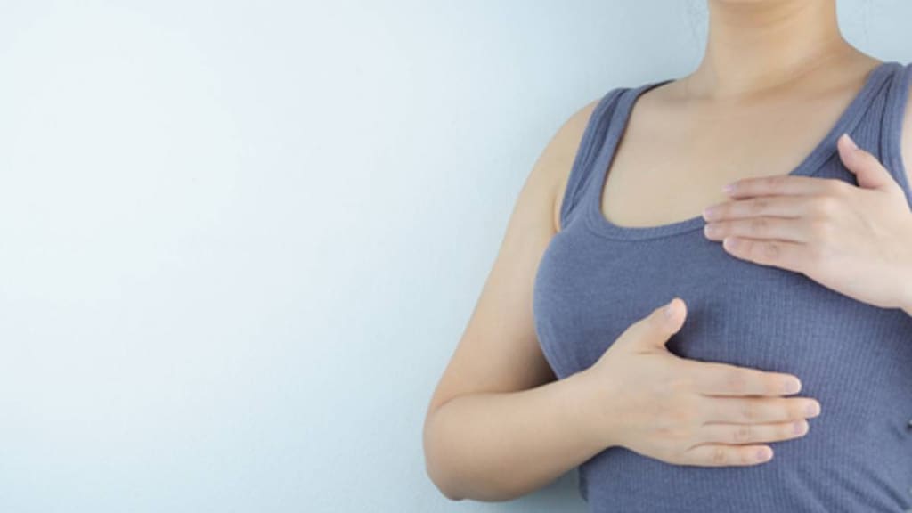 Woman doing a breast exam