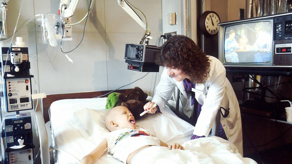 Child with cancer in hospital bed