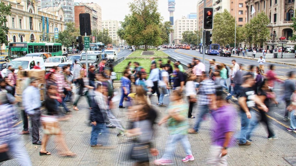 People walking across the road