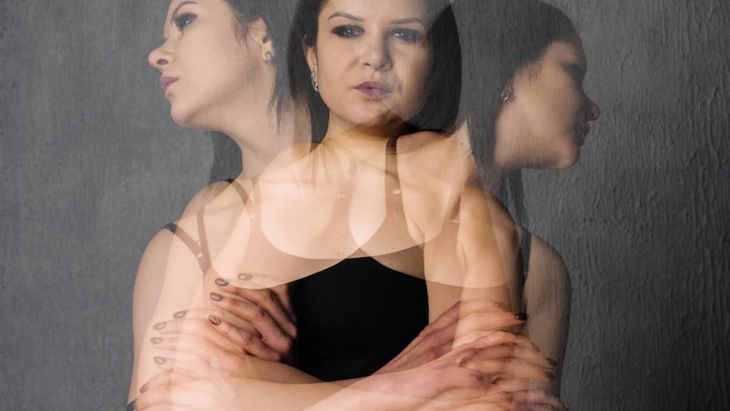 Woman with ghosted versions of emotions