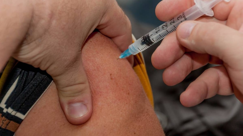 Person getting a vaccine injection