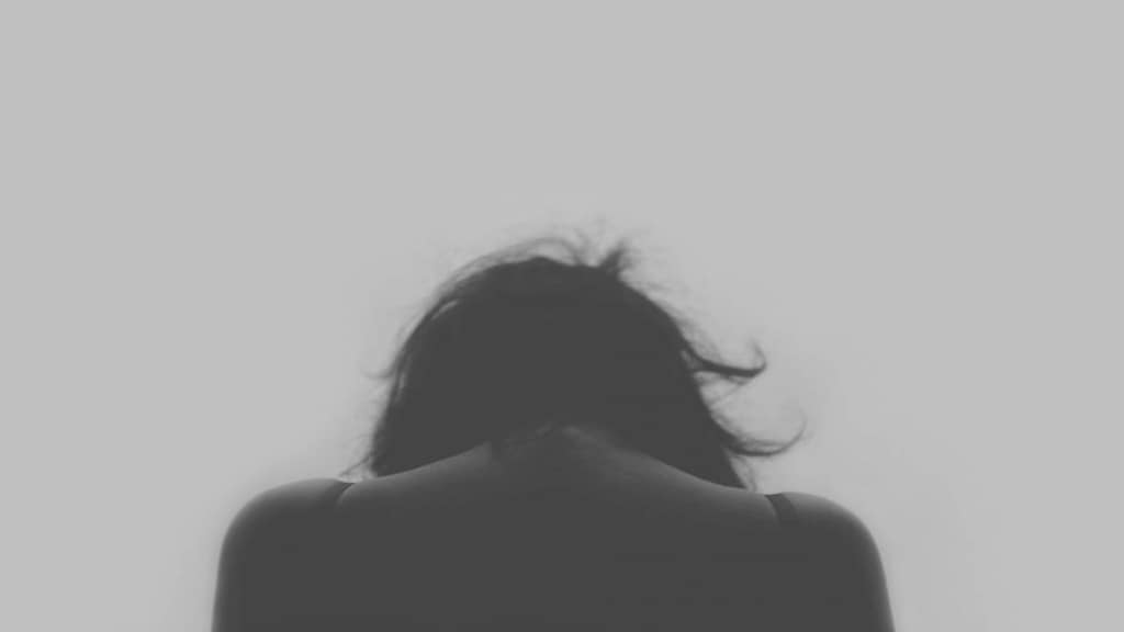 Woman looking sad from behind